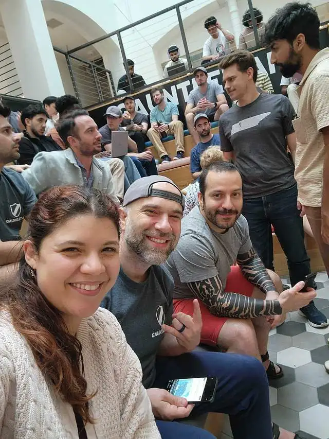 Challengers together on the atrium bleachers at Gauntlet HQ